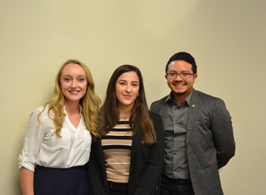 Alex Friesen (left) stands with fellow business students. 