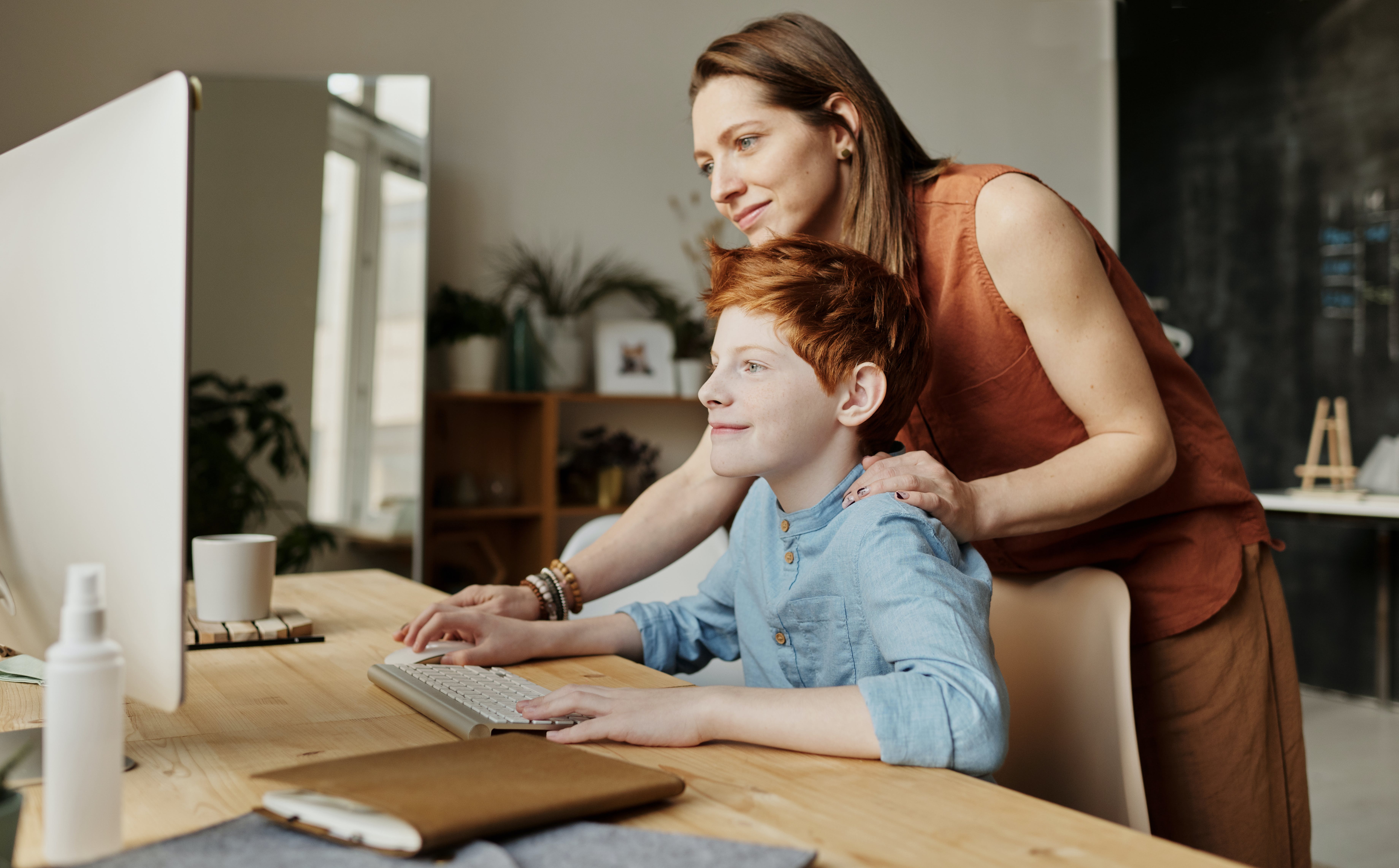 parent and child at a computer